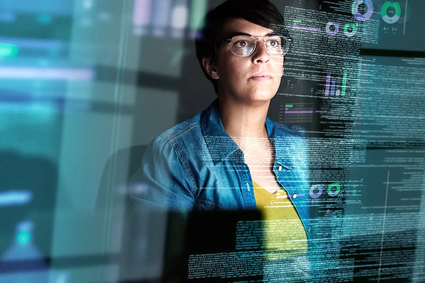 Young female computer programmer working on code